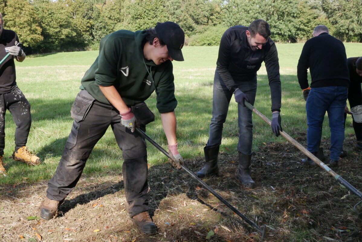 Volunteers turing over some soil