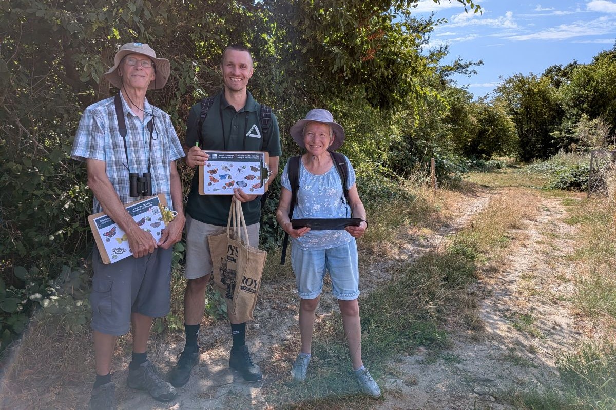 Volunteers showing their identifying nature sheets