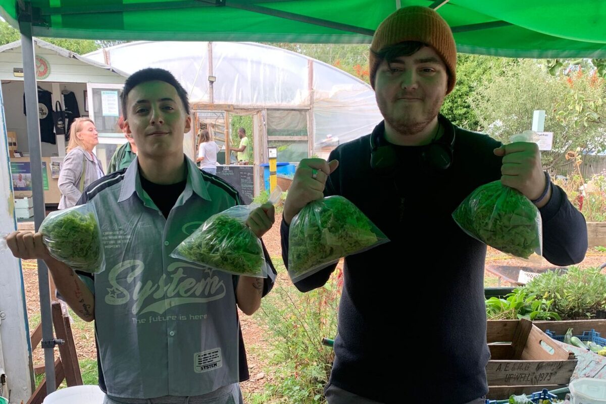 Project participants with bags of lettuce