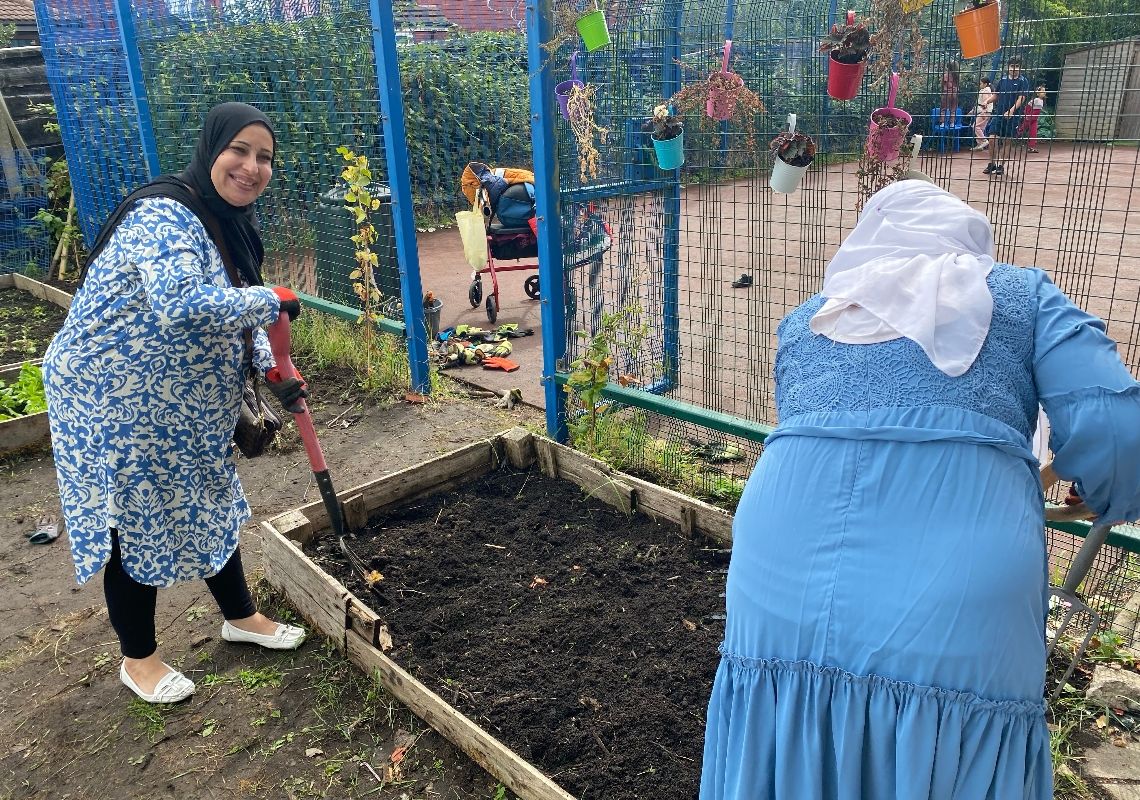 Participants planting at Rainbow Haven