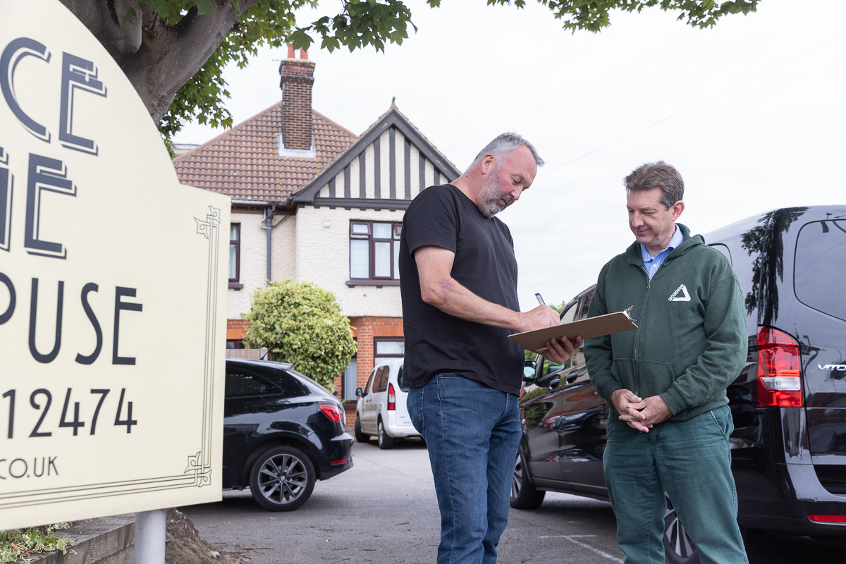 A business owner and sbs team member outside their business